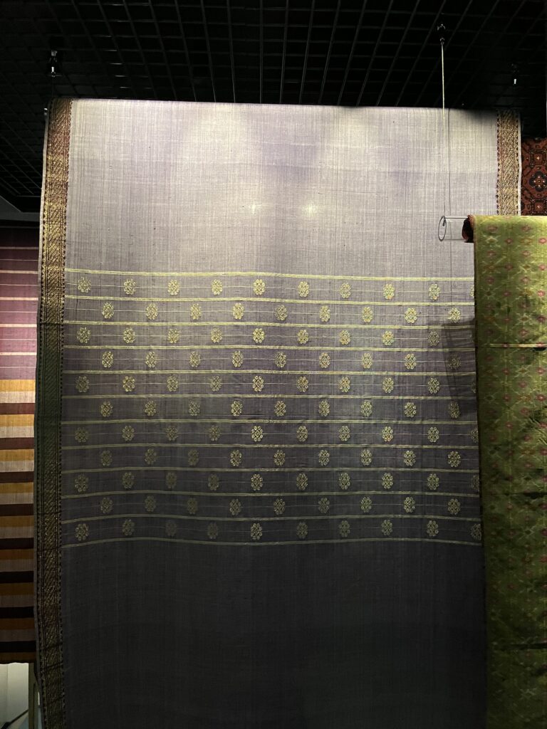 Textiles woven by Halimah on display.